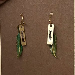 Yellow gold metal feather Gemini zodiac earrings